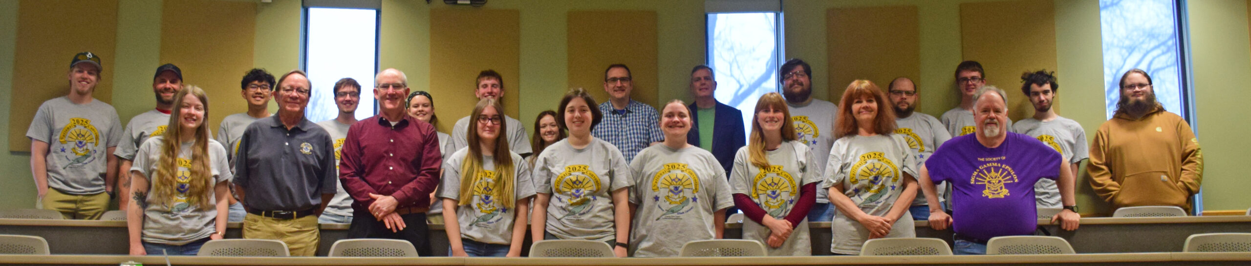 a group of students and national officers pose at the end of the biennial convention. Most are wearing SGE logo Tee-Shirts